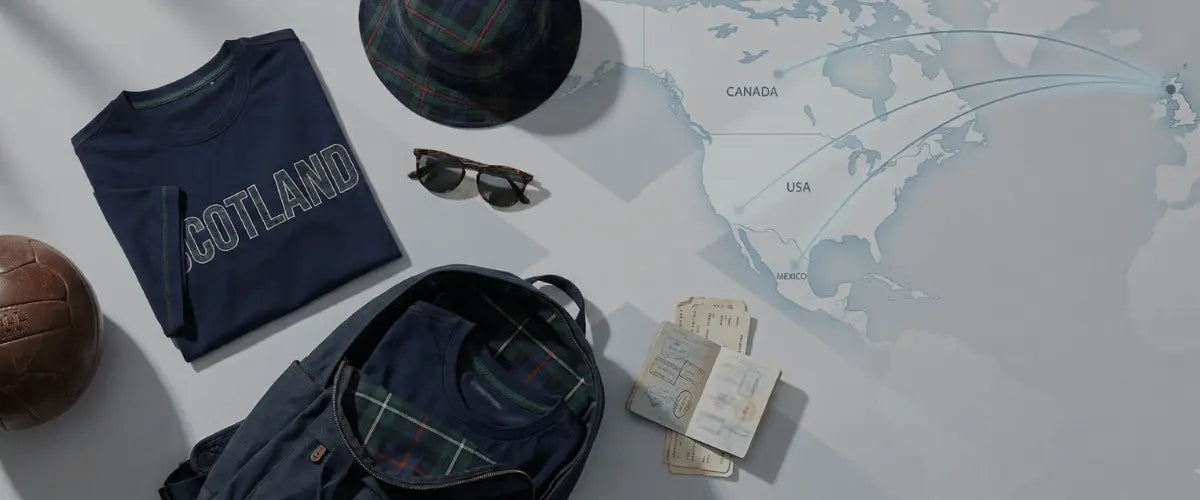 worldcuptees hero banner image showing a map of north america, passport and air tickets with apparel such as t-shirts, bags and hats.